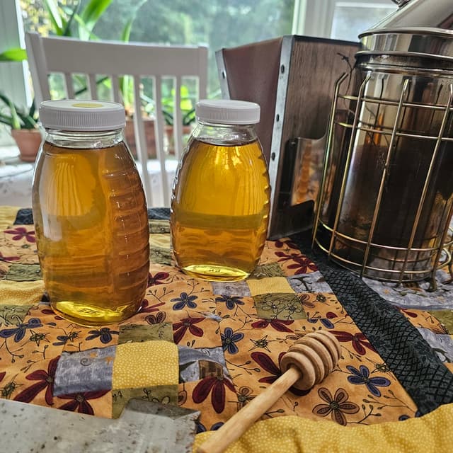Jars of honey with smoker